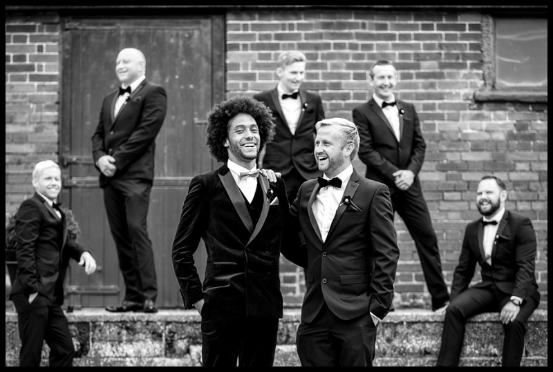 cool stylish fun photo of groom and groomsmen at smeetham hall barn