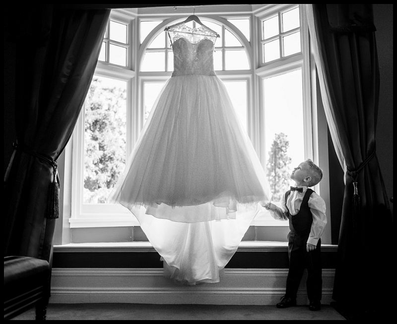Boy looking at wedding dress
