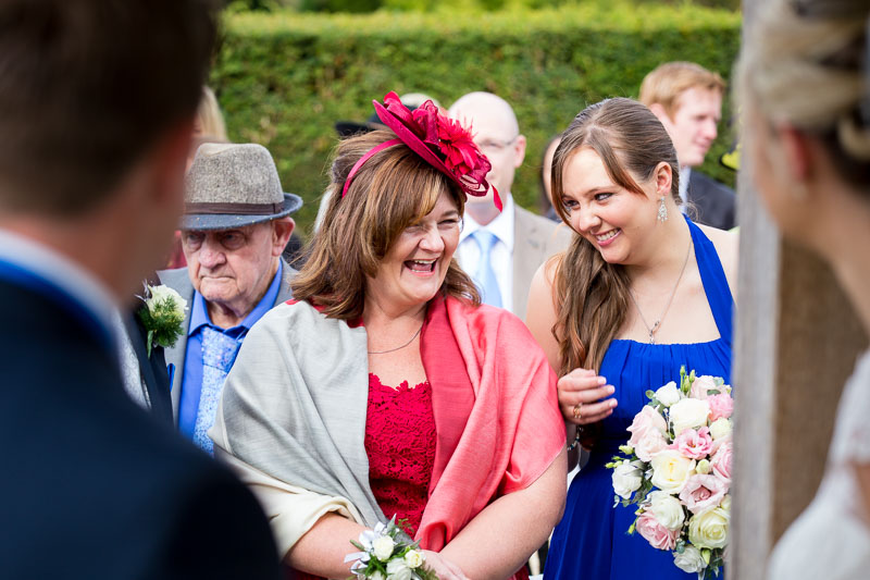 Mother of the bride and bridesmaid laughing