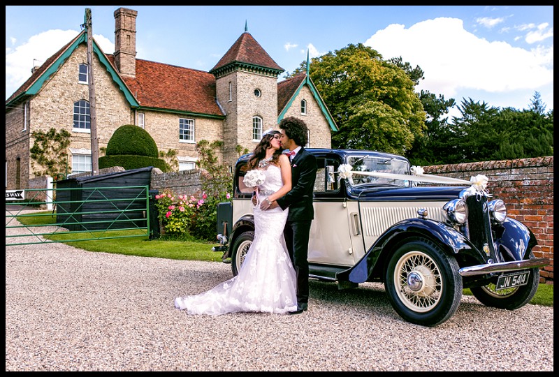 1940's style bride and groom with hillman minx at smeetham hall barn romantic portrait
