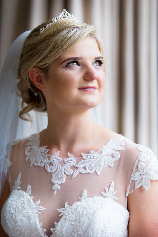 Head and shoulder portrait of bride in bridal suite at Chippenham Park wedding venue in Cambridgeshire