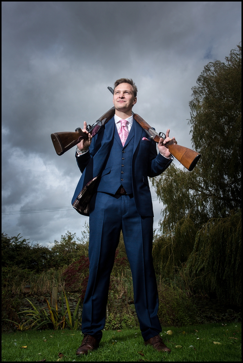 pub wedding groom with guns